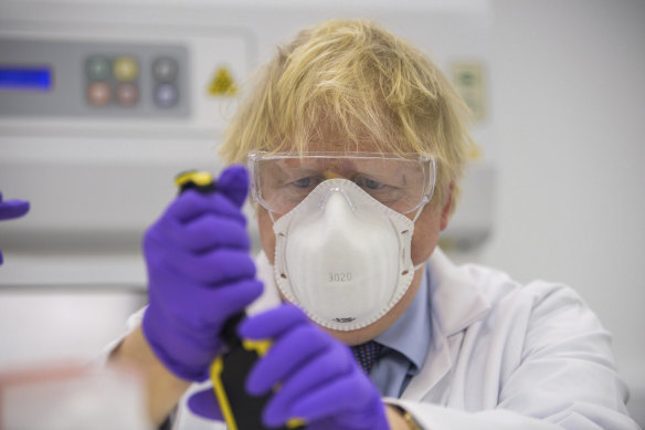 British Prime Minister Boris Johnson visits the lab of French biotechnology firm Valneva in Livingston, Scotland.