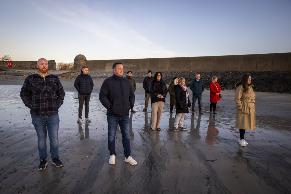 Victims and survivors of the Troubles gather in Killough, Downpatrick, County Down, Northern Ireland to watch the sun rise to mark the 25th anniversary of the Good Friday Agreement on Friday.