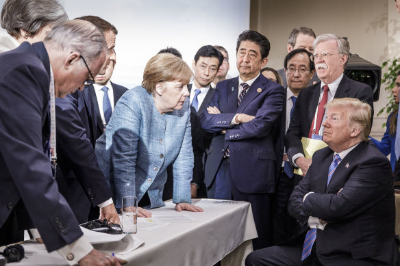 German chancellor Angela Merkel deliberates with then-US president Donald Trump in 2018.