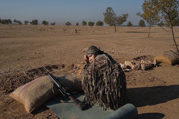 A YPJ fighter sharpens her weapon skills in a remote training camp in Al-Hasakah, Syria. Kurdish female fighters are expanding their ranks on the frontlines and elsewhere in the fight against Islamic State and Turkish back militants in northeastern Syria.