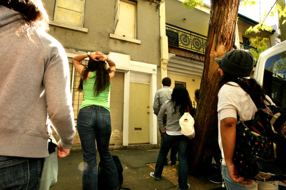 Shut out: Would-be tenants wait to inspect a property in Chippendale.