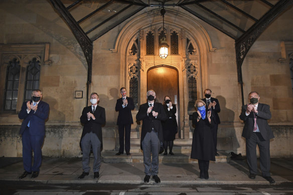 Sir Lindsay Hoyle, Speaker of the House of Commons, centre, and members of the house take part in a clap in honour of Captain Sir Tom Moore, the 100-year-old charity fundraiser who died on February 3, 2021.