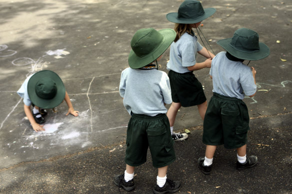 Kindergarden students play during recess.