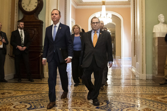 Adam Schiff, left, Jerrold Nadler and other House impeachment managers walk to the Senate chamber on Capitol Hill.