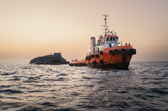 Oil tankers and cargo vessels anchored off Port Sultan Qaboos in Muscat, Oman, on Sunday.