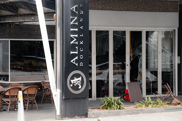 A jerry can and an upturned table outside Almina restaurant, which was damaged in an arson attack. 