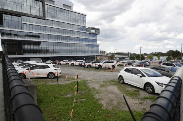 The modern Government Services building, completed in 2011 on Thomas Street, sits near a dated parking lot.