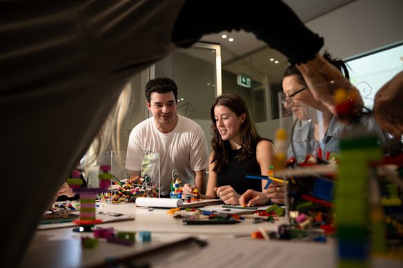 Daniel Teitelbaum, founder and lead facilitator of Playful Thinking, holding a workshop on negotiation with Communities in Control staff Meg Singleton and Rose Mircevski.