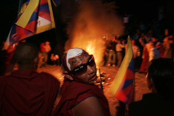 Tibetan exiles set fire to Chinese goods in Dharamshala in 2008 after a crackdown by Chinese troops against protests in Tibet.