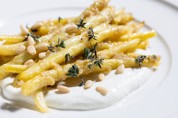 Butter beans on a creamy swirl of goat’s cheese, with pine nuts for crunch.