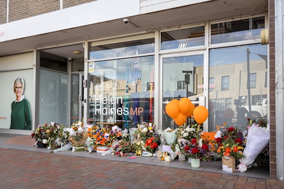 The growing floral tribute now in place for Haines outside her electorate office.