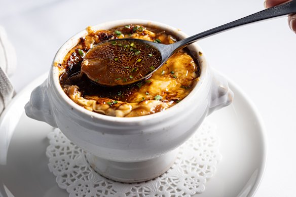 The soup's base is a reduced beef stock of depth and distinction.