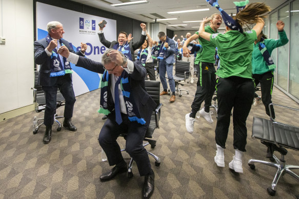 Australian officials and players celebrate in Sydney as FIFA announced Australia and New Zealand would host the 2023 Women's World Cup.