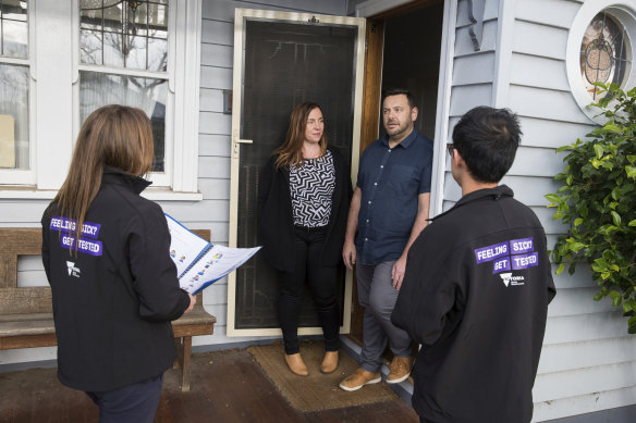 Brimbank residents Sasha and Stephen Torsi talk to community engagement workers on Wednesday. 