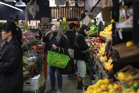 Shoppers browse the fruit and vegetable stalls at South Melbourne market earlier this month.