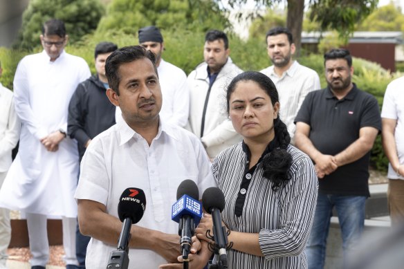 Ankur Chhabra speaks with family and friends behind him.