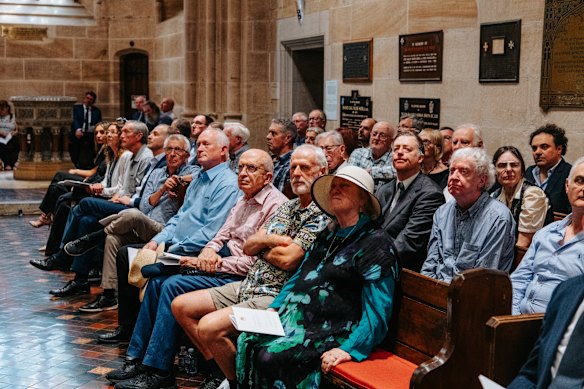 Members of the public attend the state funeral of John Laws. 