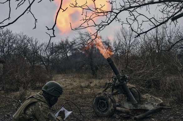 Volunteer soldiers fire towards Russian positions close to Bakhmut on Wednesday.