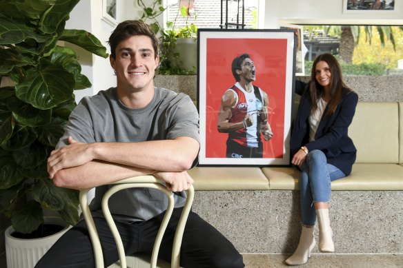 St Kilda co-captain Jack Steele with artist Dom Gauci and her artwork of him.