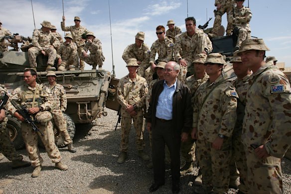 John Howard visiting Australian soldiers in Afghanistan in 2007. Australia’s military presence would remain until 2021.