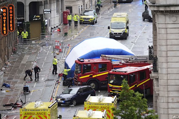 Police erect a tent where the car hit pedestrians.