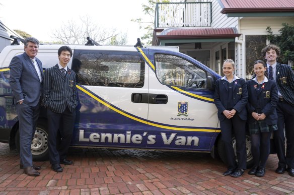 St Leonard’s College principal Peter Clague (left) with student volunteers who went to a local council estate aboard Lennie’s Van to prepare breakfast for residents.