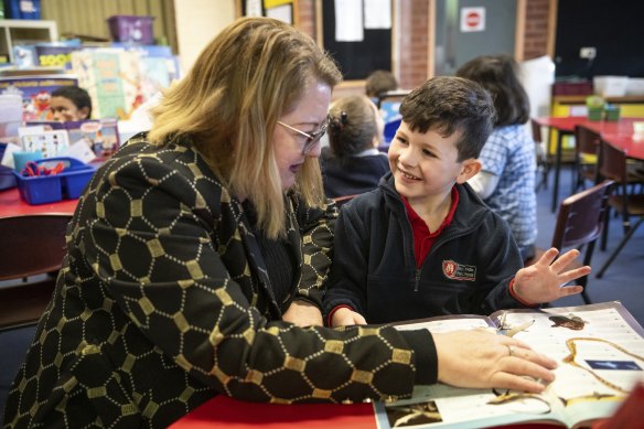 Education Minister Natalie Hutchins with prep student Henry at Moonee Ponds Primary School on Wednesday.
