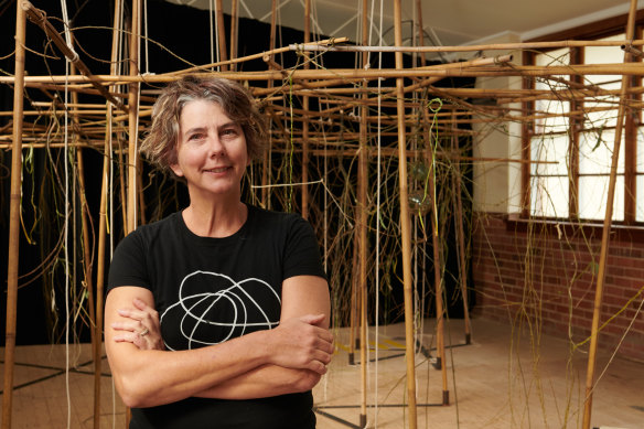 Leanne Thompson with her woven installation, Permeare, at St Dominic’s Church Hall in Kandos.