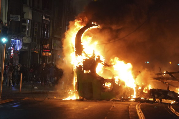A bus on fire on O’Connell Street after violent scenes unfolded in Dublin.