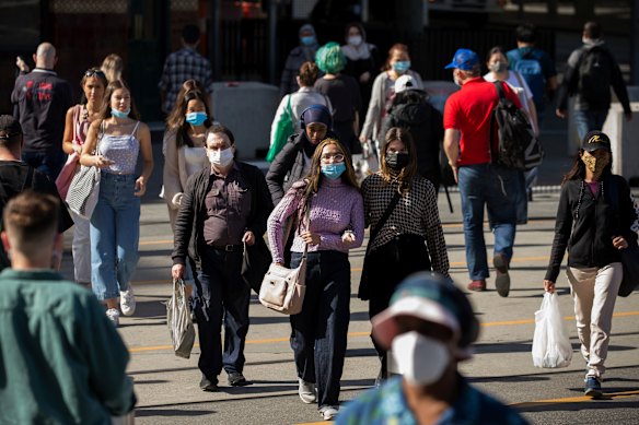 People on the corner of Flinders and Swanston streets this week.