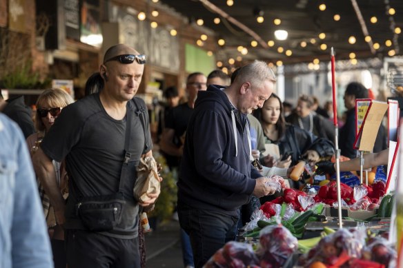 Shoppers browse at South Melbourne Market. 