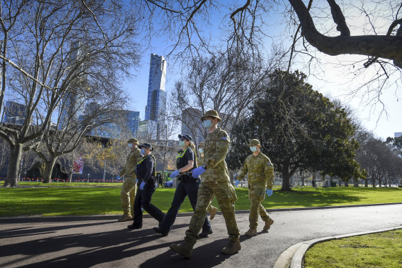 Police and Defence Force troops enforced rules under Victoria’s state of emergency.