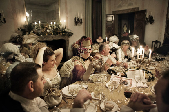 Masked guests at a party during Carnivale.