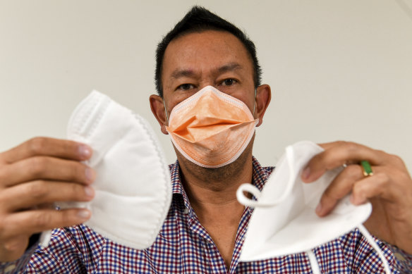 Dr Carl Le worries fake copies of face masks suitable for health professionals are in use in Australian hospitals. He says the two white masks pictured do not meet medical standards because of the straps. 