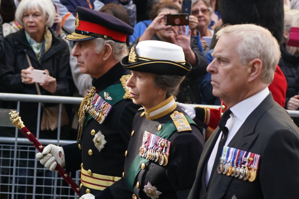 King Charles III, Princess Anne and Prince Andrew walk behind the Queen’s coffin.