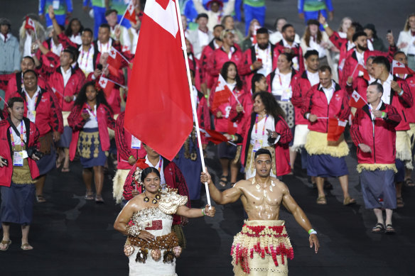 Team Tonga enter the Alexander Stadium during the opening ceremony of the Commonwealth Games.