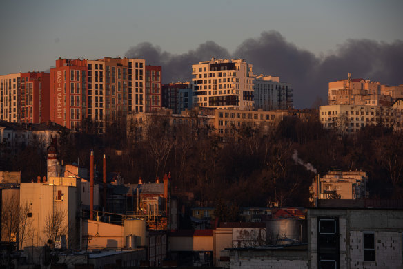 Smoke is seen above apartment blocks on March 18, 2022 in Lviv, Ukraine. Lviv’s mayor said on Telegram that the airport was not hit, but an area nearby.