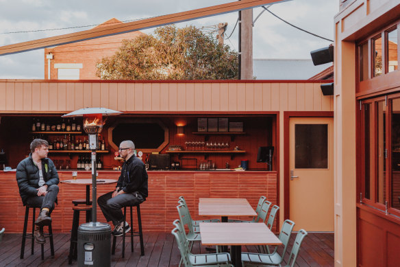 The outdoor area has its own bar and a retractable awning.