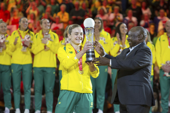 Australian captain Liz Watson collects the World Cup trophy.