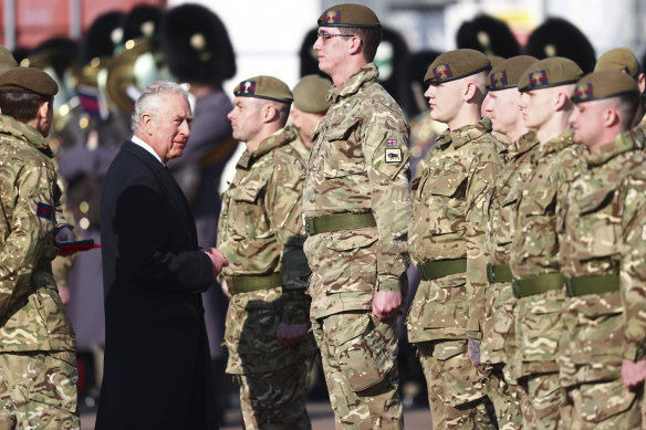 Prince Charles, as Colonel of the Welsh Guards, presents medals to The Prince of Wales’ Company at the Combermere Barracks, Windsor, on the day his brother’s case with Virginia Giuffre was settled. Sources said Charles contributed funds to help his brother.