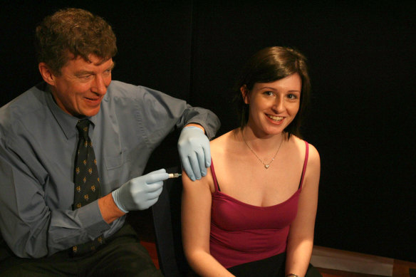 Professor Frazer personally administering shots of the HPV vaccine in 2006.