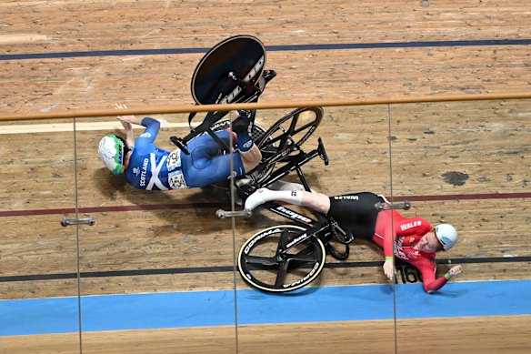 (L-R) Lauren Bell of Team Scotland and Rhian Edmunds of Team Wales fall during the women’s keirin.