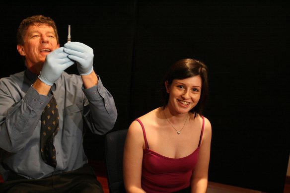 Professor Ian Frazer prepares to give Therese Raft a shot of Gardasil, the world’s first cervical cancer vaccine, in 2006.