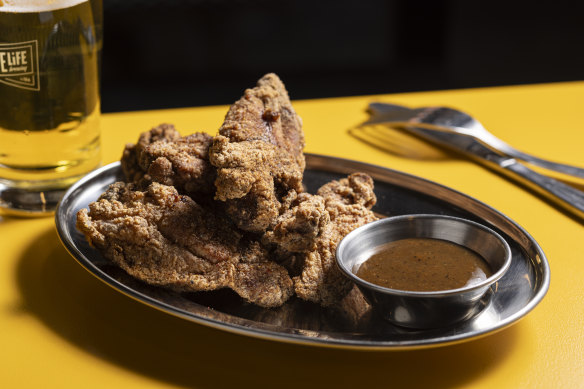 Fried chicken “chops” with burnt pineapple sauce.