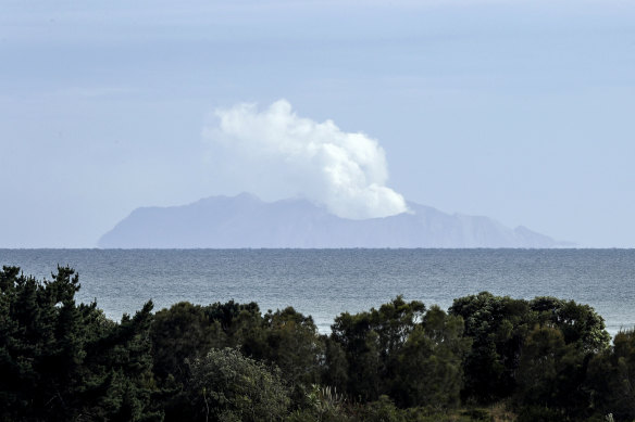 Plumes of steam rise above White Island off the coast of Whakatane, New Zealand, two days after a volcanic eruption on December 9, 2019. 