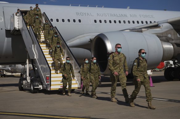 ADF personnel arriving at Tullamarine on Friday afternoon.