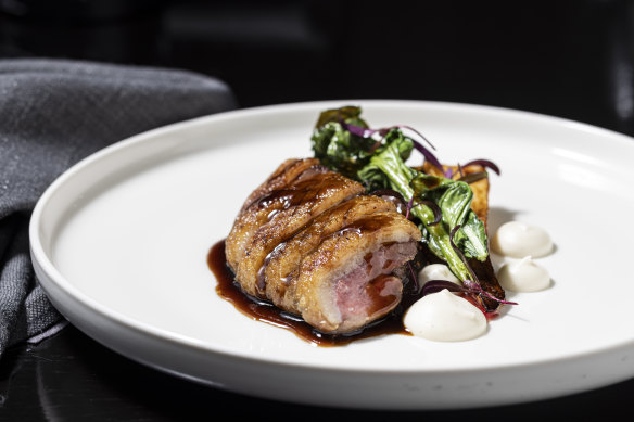 Aged duck breast with maple syrup-basted parsnips, cime di rapa and a sauce finished with dark chocolate.