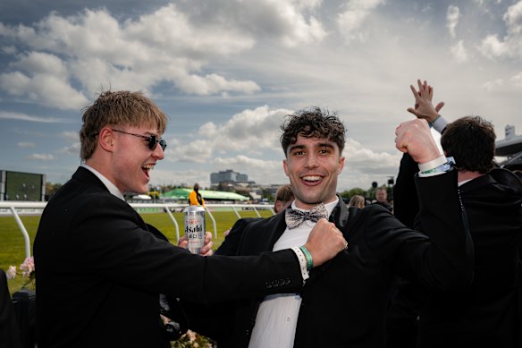 Eli Wilson, from Bundoora, and Brady Last, from Tasmania’s Devonport, celebrating after Brady won $3000 at Flemington.
