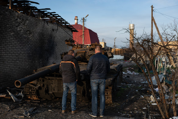 In Hostomel, where two men examine a burnt out tank, onlookers have regularly confused Ukrainian tank ruins with Russian ones. 