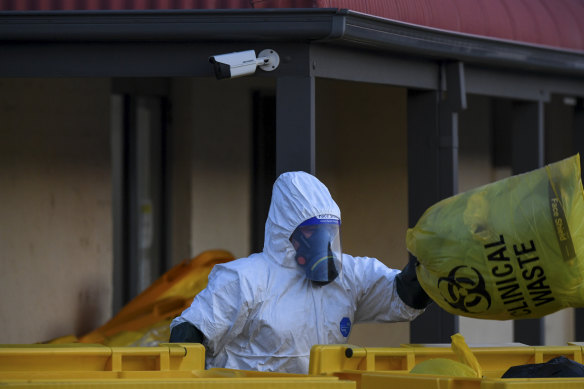 Clinical waste removalists at St Basil's in Fawkner on Saturday.
